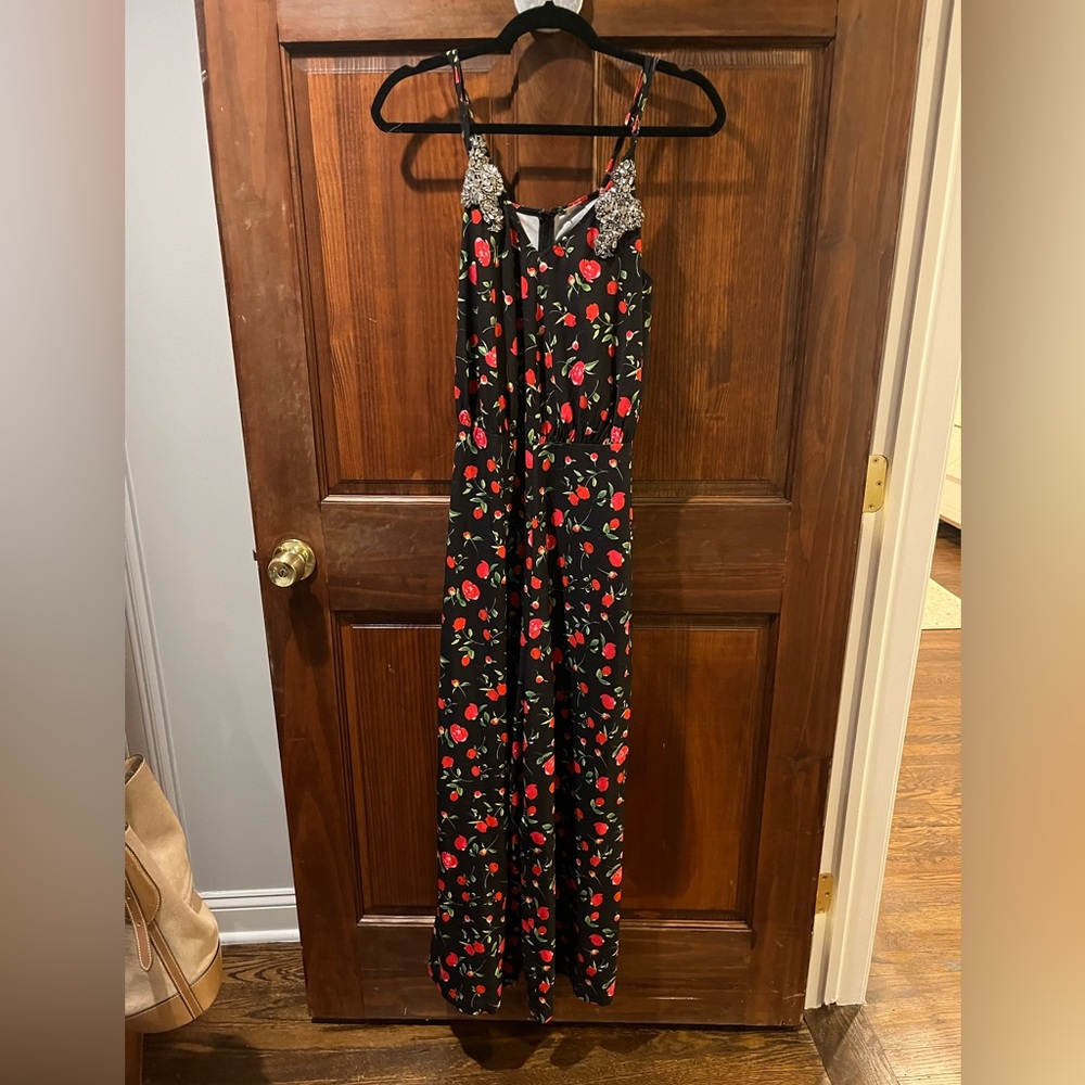 Rose jumpsuit with embellished top details. 
Brand dodo bar or
Size European 40